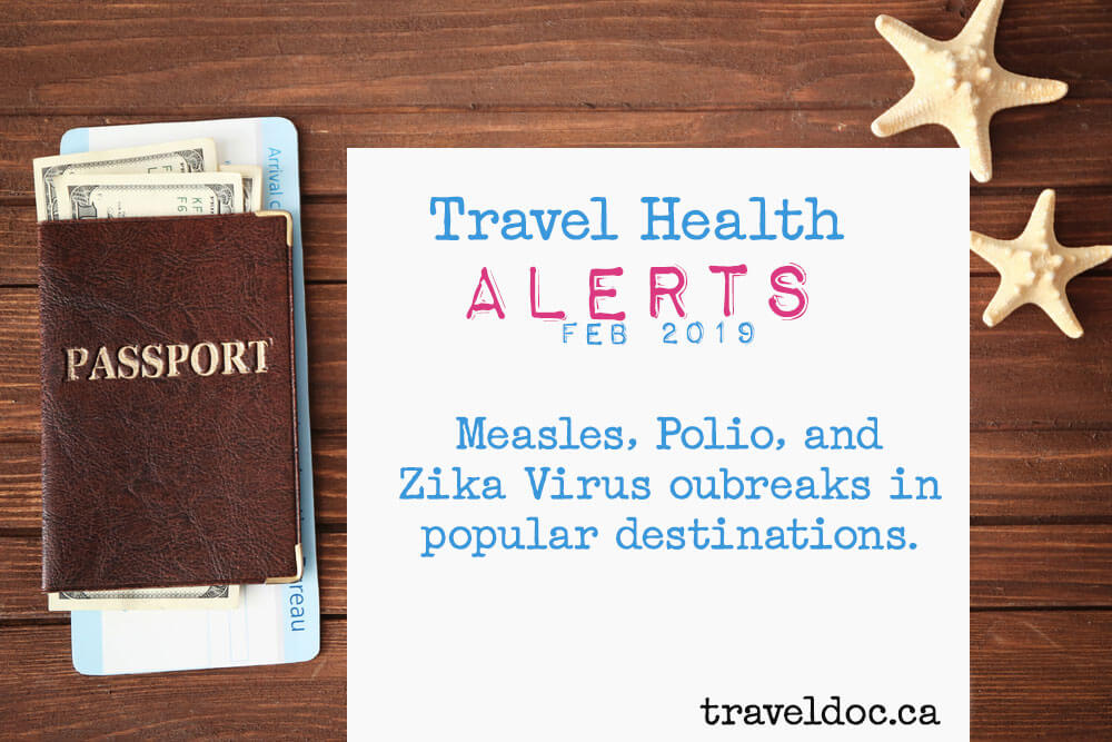 A white page appears on a wooden desktop next to two starfish and a passport with money and a ticket inside. It says "Travel Health Alerts FEB 2019 Measles, Polio, and Zika Virus outbreaks in popular destinations. traveldoc.ca"